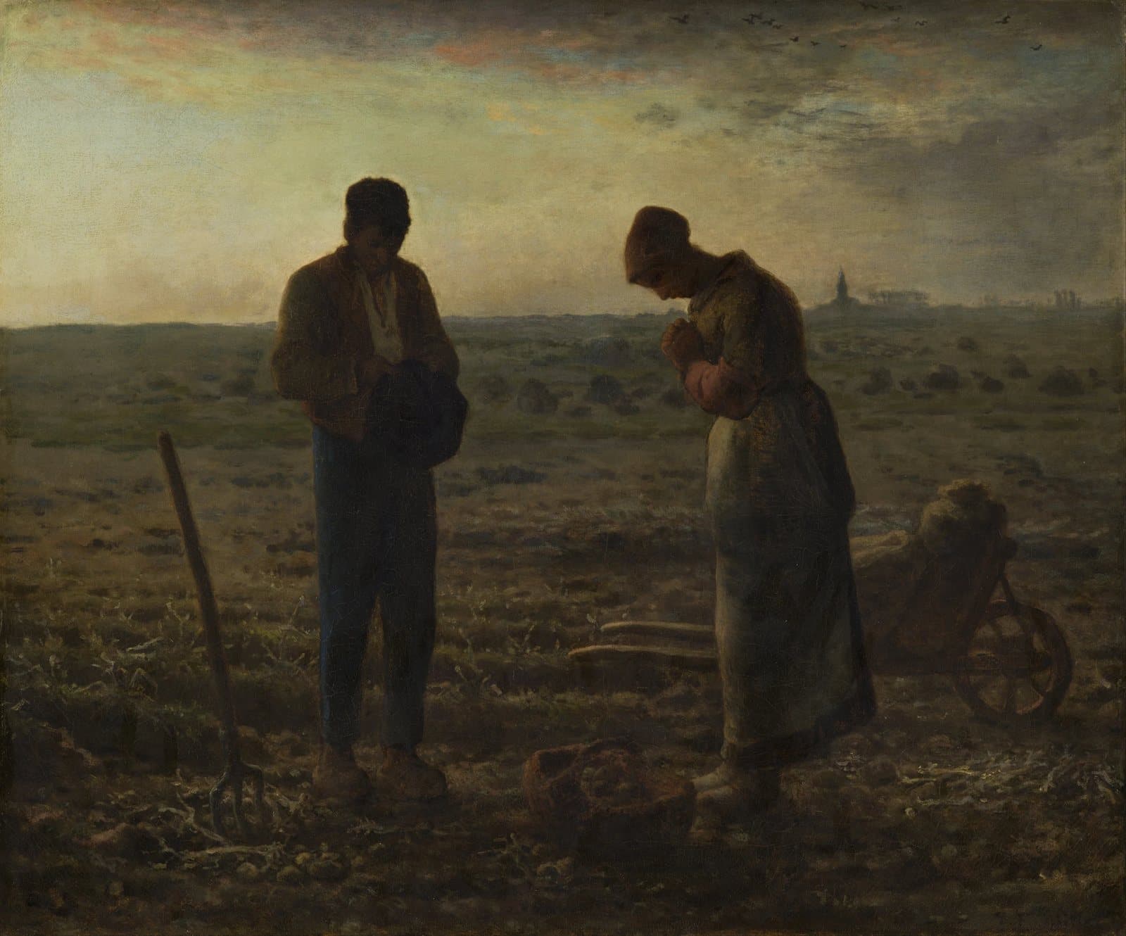 Two farm workers pause in a field at dusk, heads bowed, a basket of potatoes at their feet