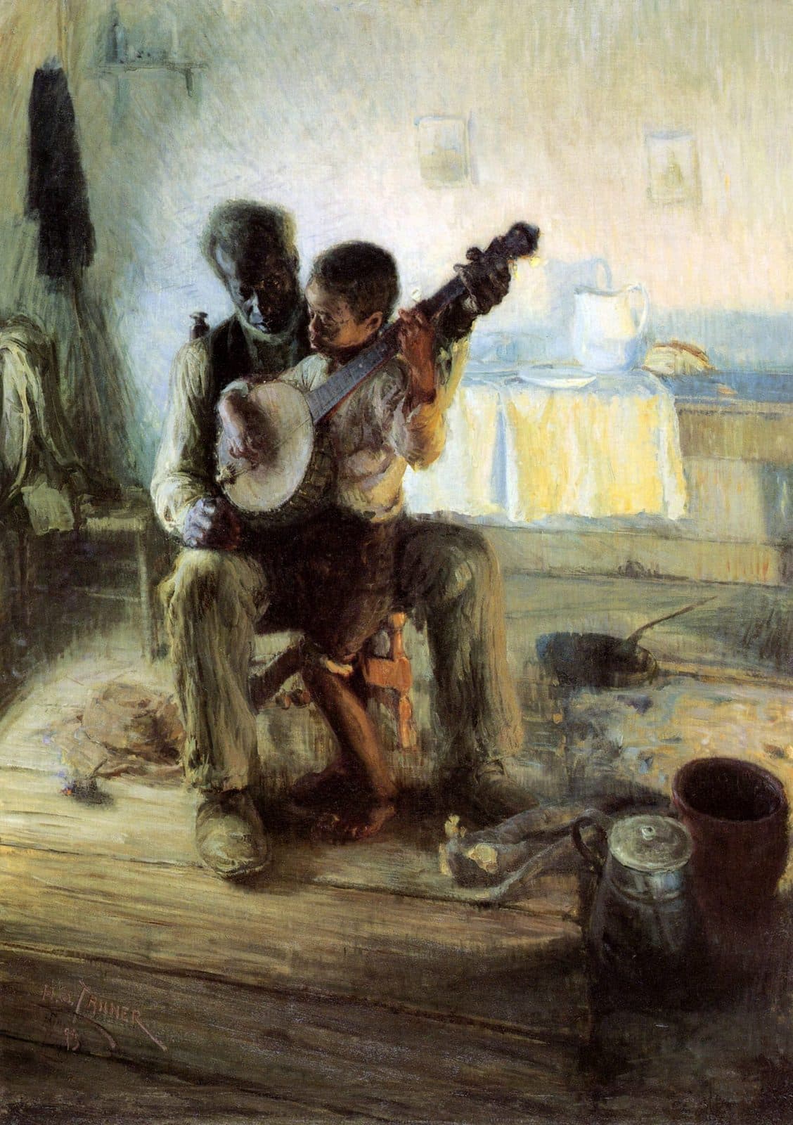 By firelight, an old man guides a small boy's hands as the boy plays a banjo on his lap